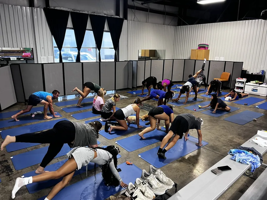 A private Pawty Yoga class in session for a Houston team